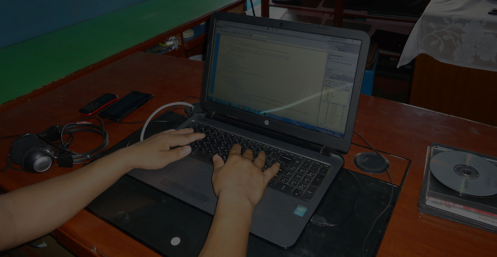 PHP code on a monitor in Profile Nepal's development office in Kathmandu